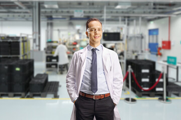Male laboratory worker with protective goggles in a factory