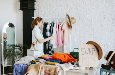 middle aged woman female woman at swap party try on clothes, bags, shoes and accessories, change...