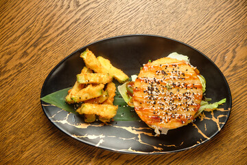 Pumpkin burger with nuts and chickpeas with tomato salsa, spinach