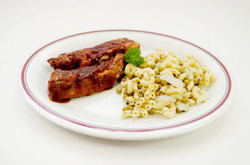 Bar-b-qued Ribbets with Sauce and Macaroni with Garlic, Peas and Onions as a Side Dish