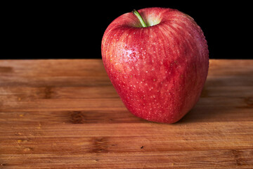 red apple on wooden background