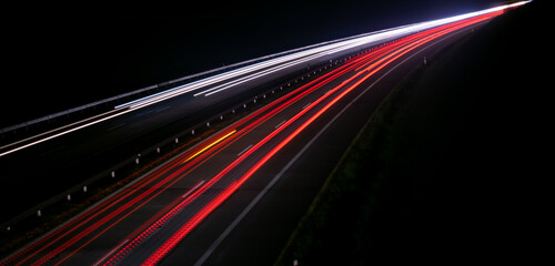 Fototapeta na wymiar abstract red car lights at night. long exposure