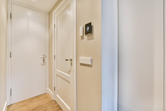 Closed doors in light corridor in flat