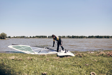 Windsurfer on a windy summertime day at the lake.
