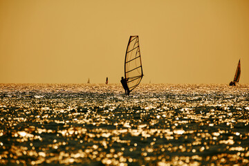 Windsurfer on the open sea ocean waters.