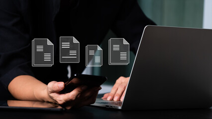 E-signatures, electronic document management, and the notion of a paperless office A businesswoman...