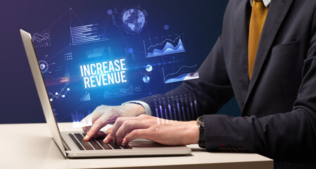 Businessman working on laptop, business concept