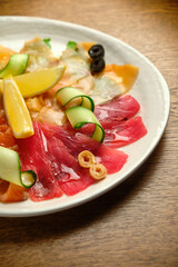 Slices of salted salmon with pepper and vegetables