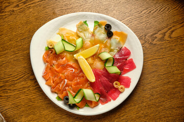 Slices of salted salmon with pepper and vegetables