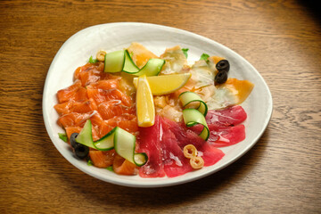 Slices of salted salmon with pepper and vegetables