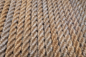 Strips of hemp rope arranged along, background texture ...