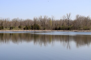 The peaceful reflecting lake on a sunny day.