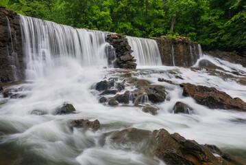 Fototapeta na wymiar Cascading water over old mill site in Tennessee