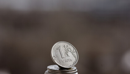 Сoin one Russian ruble on grey blurred background, copy space, mock up