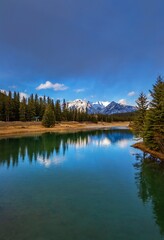 Fototapeta na wymiar Mountain Reflections On A Calm Banff Lake