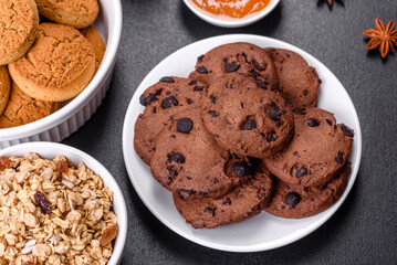 Delicious nutritious healthy breakfast with granola, eggs, oat cookies, milk and jam