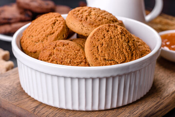 Delicious nutritious healthy breakfast with granola, eggs, oat cookies, milk and jam