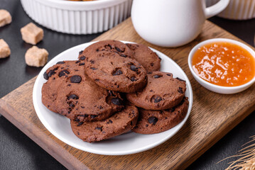 Delicious nutritious healthy breakfast with granola, eggs, oat cookies, milk and jam