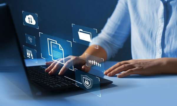  Software online documentation database and digital file storage system and file access concept.Enterprise resource planning. Business person using a laptop with digital graph to document management.