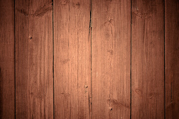 Old wooden red, brown background of boards with cracked and peeling paint. Wooden texture. Fence