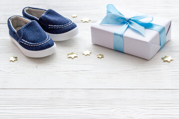 Baby boy blue shoes with gift box. Baby shower party set