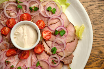 Steak tartar is served with capers