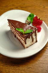 Plate with slice of tasty homemade chocolate cake