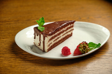 Plate with slice of tasty homemade chocolate cake