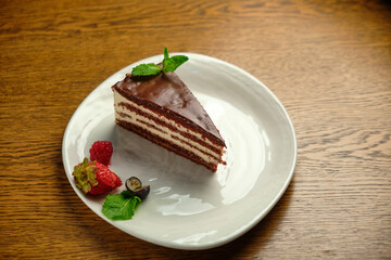 Plate with slice of tasty homemade chocolate cake