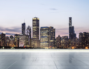 Empty concrete rooftop on the background of a beautiful blurry Chicago city skyline at twilight, mock up