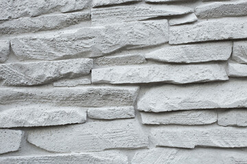 grey wall of imitation natural stone made with cement