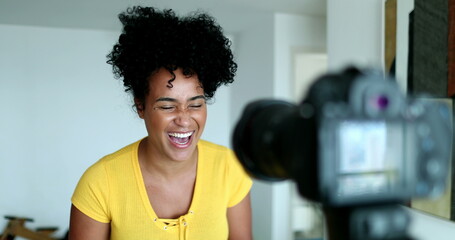 Fototapeta na wymiar African American female vlogger speaking to social media channel