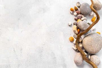 Frame of natural mineral rocks with snag tree branch