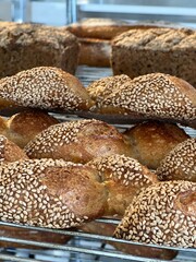 freshly baked breads on display on the bakery racks