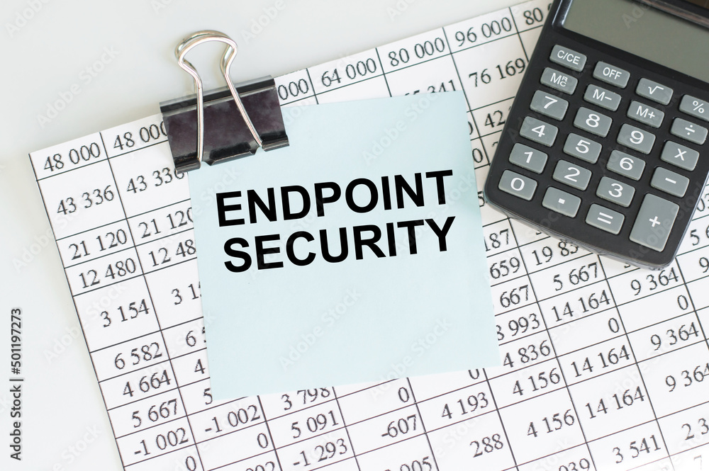 Aufkleber endpoint security text on a card on the background of a report with a calculator, a business concept