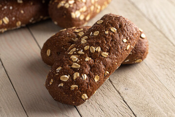 Brown Bread with Oats on a Light Wood Table