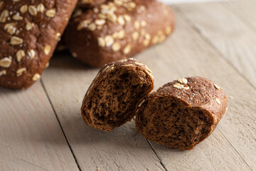 Brown Bread with Oats on a Light Wood Table