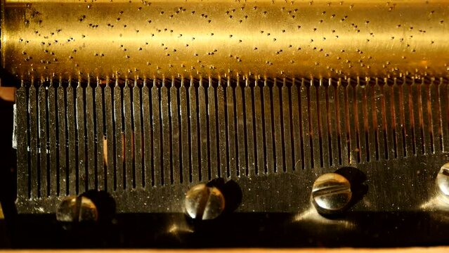 Vintage golden jukebox inside mechanism close-up