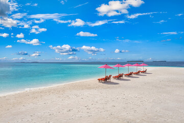 Obraz na płótnie Canvas Amazing tranquil sea sand sky. Recreational summer travel tourism. Aerial landscape view with chairs and umbrellas on paradise island beach, seaside. Resort vacation, exotic nature. Beautiful tropics
