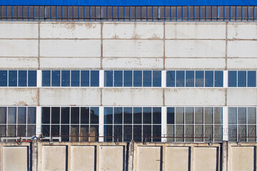 industrial workshop building is behind a fence