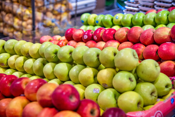Variety of colorful apples in a fruit shop