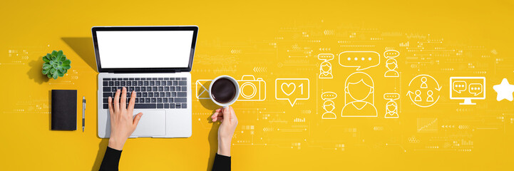 Social media theme with person using a laptop computer - obrazy, fototapety, plakaty