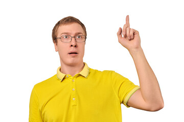 Funny young guy in corrective glasses and yellow T-shirt with eureka gesture, man got idea isolated