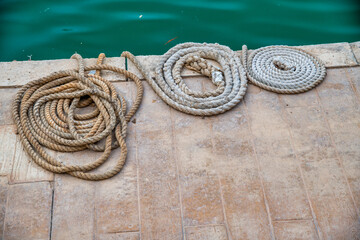 Ropes rolled up along the pier