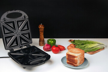 Electric kitchen sandwich maker on non isolated background