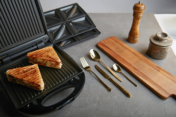 Electric kitchen sandwich maker on non isolated background