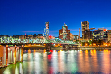 Fototapeta na wymiar Modern night skyline of Portland with river light reflections, O
