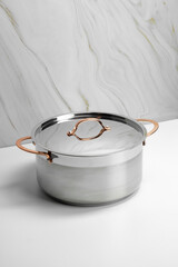 Stainless steel kitchen cookware on non isolated background