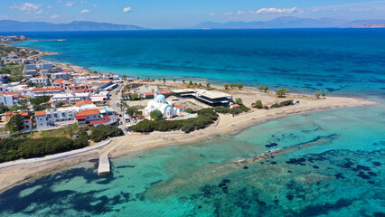 Aerial drone photo of iconic picturesque village, main port and beautiful turquoise beaches of...