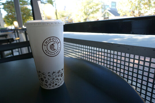 Chipotle Logo on a White Paper Cup Inside the Restaurant